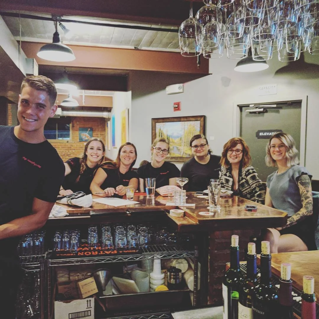 The Warehouse service team gathered at the bar before dinner service