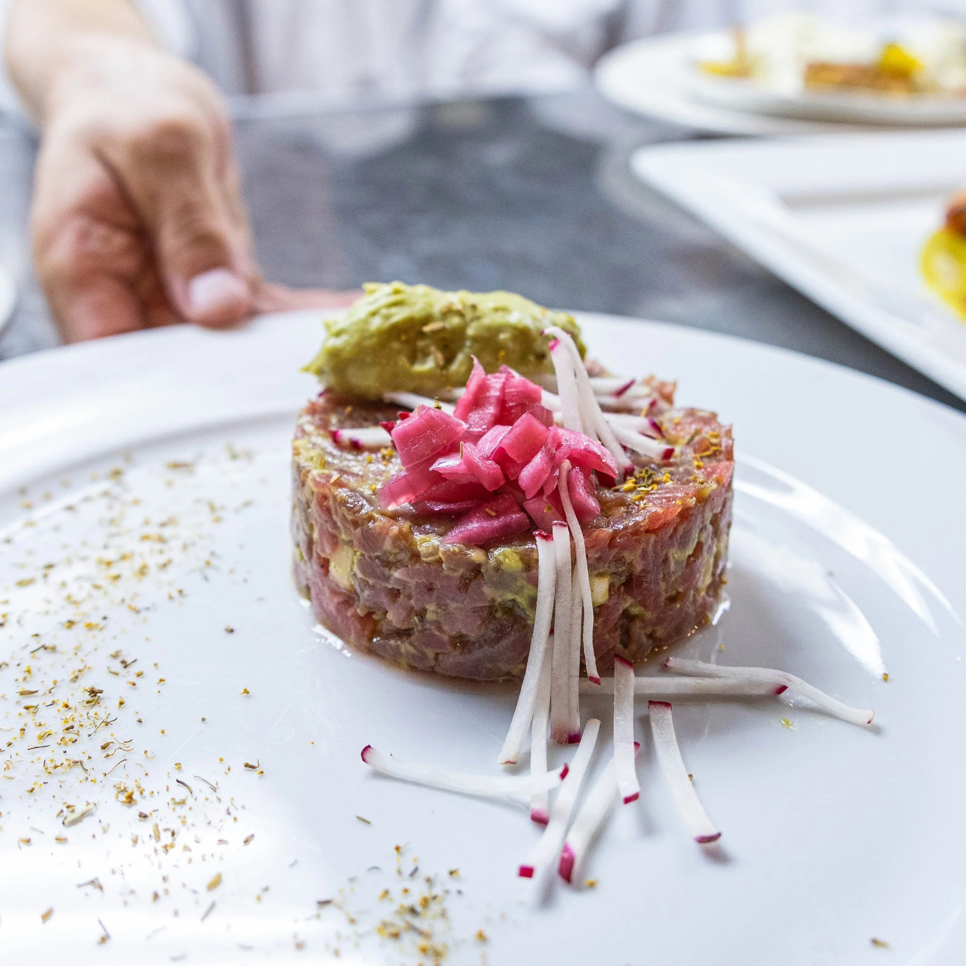 Ahi tuna tartare with avocado, pickled red onion and shaved radish