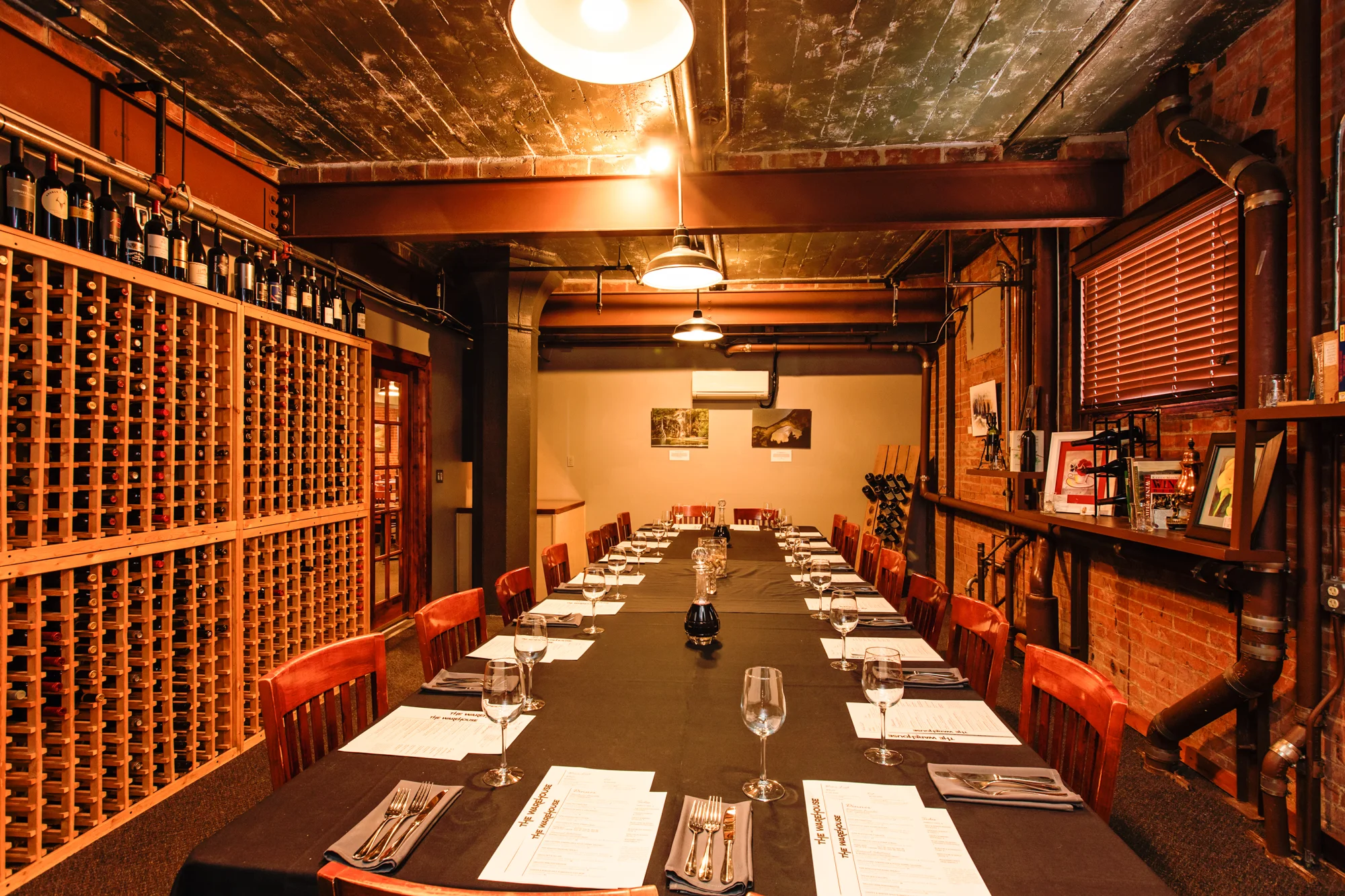 The Cellar set for a wine dinner beneath pressed-tin ceilings